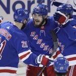 
              New York Rangers defenseman Ryan Lindgren (55) celebrates with teammates after scoring a goal against the Tampa Bay Lightning during the second period in Game 5 of the NHL Hockey Stanley Cup playoffs Eastern Conference Finals, Thursday, June 9, 2022, in New York (AP Photo/Adam Hunger)
            