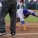
              New York Mets third baseman Eduardo Escobar can't reach a ball hit for a double by Los Angeles Angels' Anthony Rendon during the first inning of a baseball game Saturday, June 11, 2022, in Anaheim, Calif. (AP Photo/Mark J. Terrill)
            