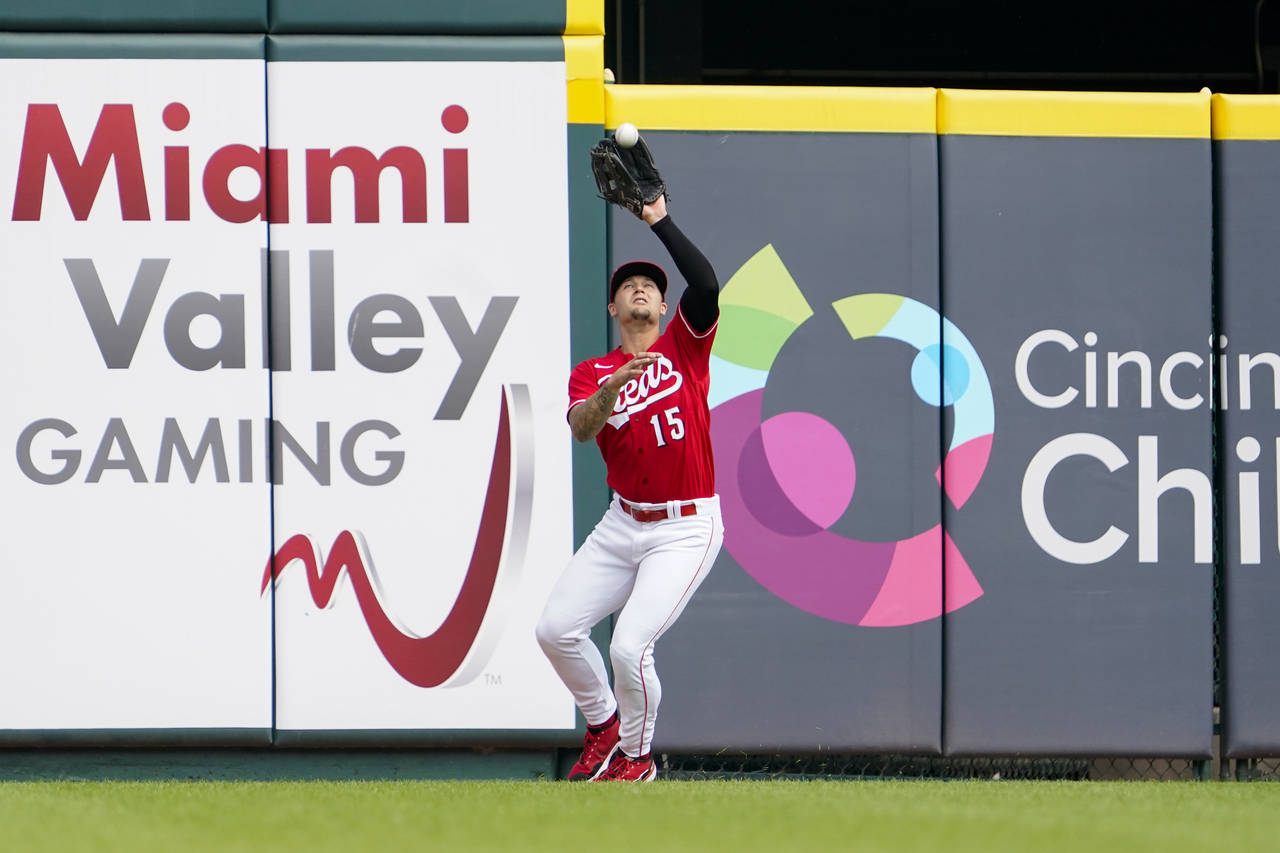 Cincinnati Reds center fielder Nick Senzel (15) catches a fly ball hit by Washington Nationals' Jua...