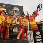 
              Joey Logano, right, celebrates with members of his crew after winning a NASCAR Cup Series auto race at World Wide Technology Raceway, Sunday, June 5, 2022, in Madison, Ill. (AP Photo/Jeff Roberson)
            