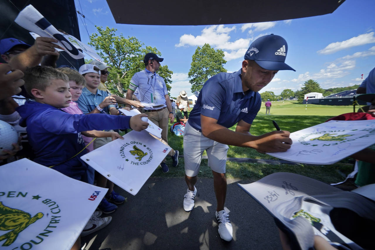 Xander Schauffele gives autographs at The Country Club, Monday, June 13, 2022, in Brookline, Mass.,...
