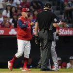 
              Los Angeles Angels' manager Joe Maddon, left, disputes a stolen base call during the fifth inning of a baseball game against the Boston Red Sox in Anaheim, Calif., Monday, June 6, 2022. (AP Photo/Ashley Landis)
            