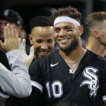 
              Chicago White Sox's Yoan Moncada (10) celebrates with teammates after scoring on a sacrifice bunt by Reese McGuire during the sixth inning of a baseball game against the Detroit Tigers, Monday, June 13, 2022, in Detroit. (AP Photo/Duane Burleson)
            