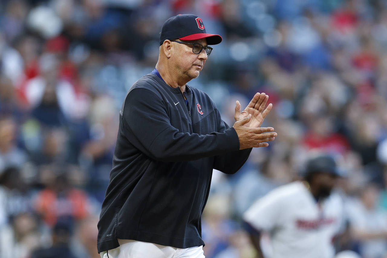 Cleveland Guardians manager Terry Francona walks to the mound to make a pitching change during the ...