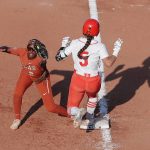 
              Texas' Janae Jefferson (2) makes the catch for an out before Oklahoma State's Kiley Naomi (5) can reach first base during the third inning of an NCAA softball Women's College World Series game on Monday, June 6, 2022, in Oklahoma City. (AP Photo/Alonzo Adams)
            