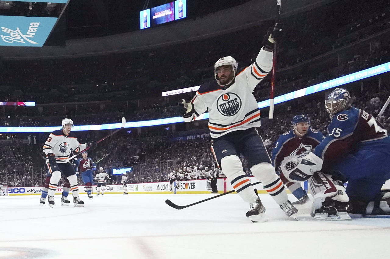 Edmonton Oilers left wing Evander Kane (91) celebrates a goal against Colorado Avalanche goaltender...
