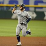 
              Seattle Mariners' Eugenio Suarez runs the bases after hitting a solo home run during the fourth inning of a baseball game against the Texas Rangers in Arlington, Texas, Sunday, June 5, 2022. (AP Photo/LM Otero)
            