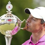 
              Rory McIlroy, of Northern Ireland, kisses the trophy after winning the final round of the Canadian Open golf tournament at St. George's Golf and Country Club in Toronto,  Sunday, June 12, 2022. (Nathan Denette/The Canadian Press via AP)
            