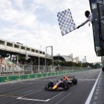 
              Red Bull driver Sergio Perez of Mexico crosses the finish line to set the second fastest time in the qualifying session at the Baku circuit, in Baku, Azerbaijan, Saturday, June 11, 2022. The Formula One Grand Prix will be held on Sunday. (Hamad Mohammed), Pool Via AP)
            