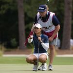 
              Danielle Kang lines up a putt on the 16th green during the second round of the U.S. Women's Open golf tournament at the Pine Needles Lodge & Golf Club in Southern Pines, N.C. on Friday, June 3, 2022. (AP Photo/Chris Carlson)
            