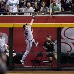 
              Minnesota Twins right fielder Max Kepler makes a leaping catch on a fly ball hit by Arizona Diamondbacks' Pavin Smith during the seventh inning of a baseball game Saturday, June 18, 2022, in Phoenix. The Twins won 11-1. (AP Photo/Ross D. Franklin)
            