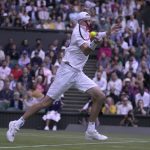 
              John Isner of the US returns the ball to Britain's Andy Murray during their singles tennis match on day three of the Wimbledon tennis championships in London, Wednesday, June 29, 2022. (AP Photo/Alastair Grant)
            
