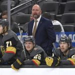 
              FILE - Vegas Golden Knights coach Peter DeBoer watches from the bench during the third period of the team's NHL hockey game against the Nashville Predators on Thursday, March 24, 2022, in Las Vegas. The Dallas Stars announced Tuesday, June 21, 2022,  that they have hired Peter DeBoer as their new coach, a month after he was fired by the Vegas Golden Knights. (AP Photo/David Becker, File)
            