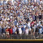 
              Fans in center field celebrate after Mississippi's Jacob Gonzalez hit a solo home run in the sixth inning against Oklahoma in Game 2 of the NCAA College World Series baseball finals, Sunday, June 26, 2022, in Omaha, Neb. (AP Photo/Rebecca S. Gratz)
            