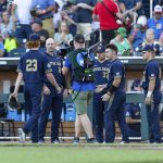 
              Notre Dame starting pitcher Austin Temple (23) is retired in the second inning against Oklahoma during an NCAA College World Series baseball game, Sunday, June 19, 2022, in Omaha, Neb. (AP Photo/John Peterson)
            