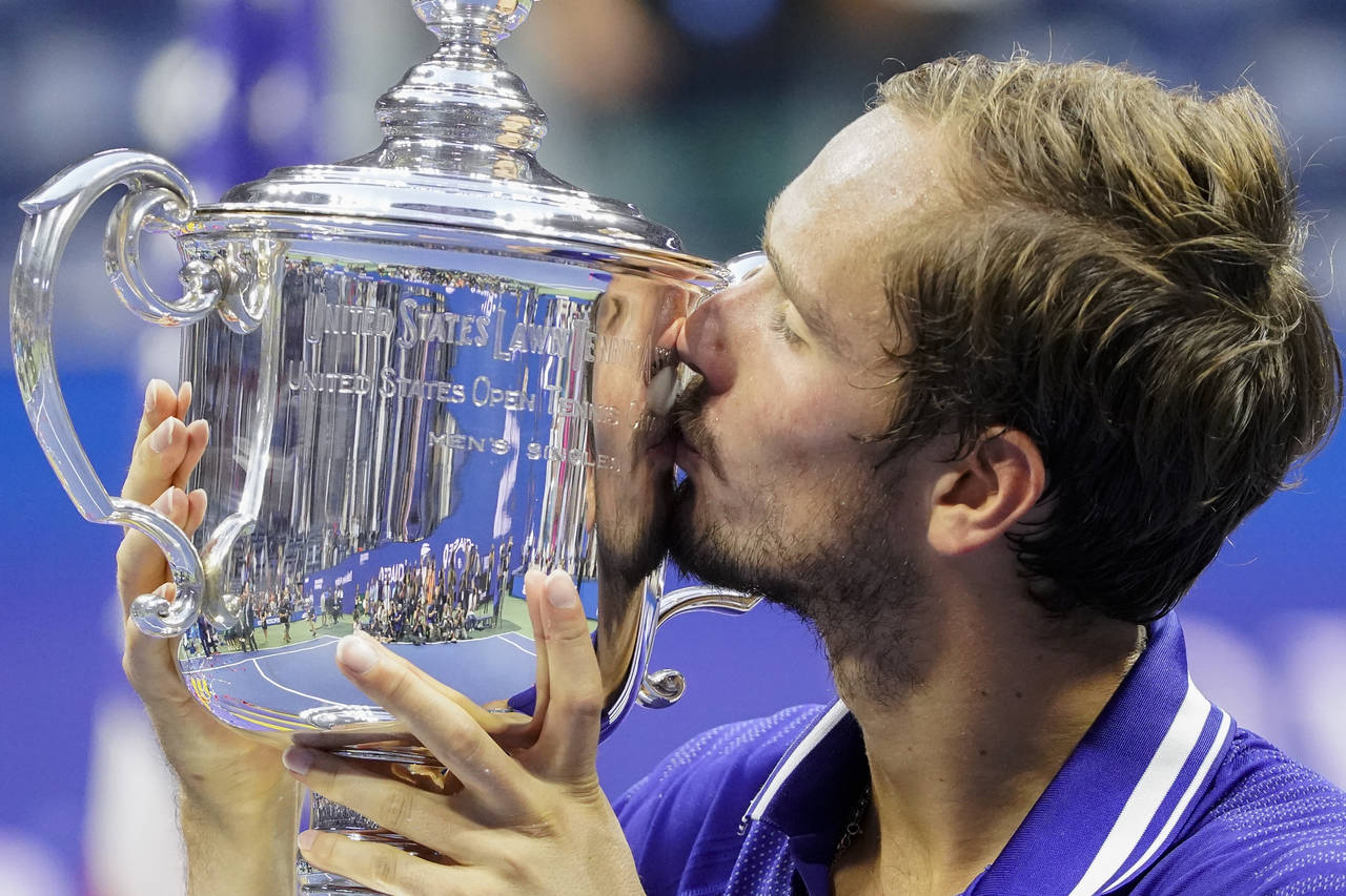 FILE - Daniil Medvedev, of Russia, kisses the championship trophy after defeating Novak Djokovic, o...
