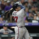 
              Atlanta Braves' Austin Riley follows the flight of his solo home run off Colorado Rockies starting pitcher Kyle Freeland in the sixth inning of a baseball game Saturday, June 4, 2022, in Denver. (AP Photo/David Zalubowski)
            