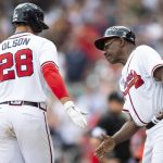 
              Atlanta Braves' Matt Olson (28) slaps hands with Ron Washington after a solo home run in the eighth inning of a baseball game against the Pittsburgh Pirates, Sunday, June 12, 2022, in Atlanta. (AP Photo/Hakim Wright Sr.)
            