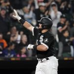 
              Chicago White Sox's Jake Burger heads for the plate, celebrating his home run off Los Angeles Dodgers starting pitcher Tony Gonsolin during the fifth inning of a baseball game Wednesday, June 8, 2022, in Chicago. (AP Photo/Charles Rex Arbogast)
            