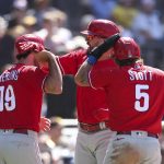 
              Philadelphia Phillies' Kyle Schwarber, background center, celebrates with Matt Vierling (19) and Bryson Stott (5) after hitting a three run home run against San Diego Padres' Nabil Crismatt in the seventh inning of a baseball game Sunday, June 26, 2022, in San Diego. (AP Photo/Derrick Tuskan)
            