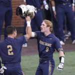 
              Notre Dame's Jack Brannigan (9) celebrates with Spencer Myers (2) after hitting a three-run home run against Tennessee in the fourth inning during an NCAA college baseball super regional game Friday, June 10, 2022, in Knoxville, Tenn. (AP Photo/Randy Sartin)
            