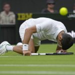 
              Serbia's Novak Djokovic slips over as he plays Korea's Kwon Soonwoo in a men's first round singles match on day one of the Wimbledon tennis championships in London, Monday, June 27, 2022. (AP Photo/Kirsty Wigglesworth)
            