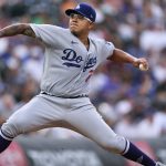 
              Los Angeles Dodgers starting pitcher Julio Urias works against the Colorado Rockies during the first inning of a baseball game Wednesday, June 29, 2022, in Denver. (AP Photo/David Zalubowski)
            