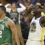 
              Golden State Warriors forward Draymond Green (23) celebrates next to Boston Celtics forward Grant Williams (12) during the first half of Game 1 of basketball's NBA Finals in San Francisco, Thursday, June 2, 2022. (AP Photo/Jed Jacobsohn)
            