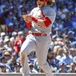 
              St. Louis Cardinals' Harrison Bader smiles after scoring against the Chicago Cubs during the fourth inning of a baseball game, Friday, June 3, 2022, in Chicago. (AP Photo/Kamil Krzaczynski)
            