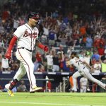 
              Atlanta Braves second baseman Orlando Arcia reacts to hitting a walk off single off San Francisco Giants pitcher Camilo Doval, right, for a 2-1 victory during the ninth inning of a baseball game on Monday, June 20, 2022, in Atlanta. (Curtis Compton/Atlanta Journal-Constitution via AP)
            