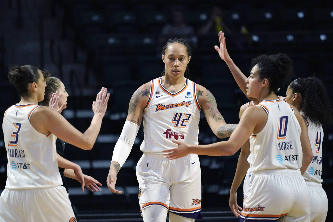 FILE - Phoenix Mercury's Brittney Griner (42) is congratulated on a play against the Seattle Storm ...