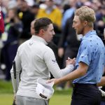 
              Matthew Fitzpatrick, left, of England, and Will Zalatoris meet after Fitzpatrick won the U.S. Open golf tournament at The Country Club, Sunday, June 19, 2022, in Brookline, Mass. (AP Photo/Charlie Riedel)
            