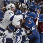 
              Colorado Avalanche and Tampa Bay Lightning players scuffle during the third period in Game 2 of the NHL hockey Stanley Cup Final on Saturday, June 18, 2022, in Denver. (AP Photo/John Locher)
            