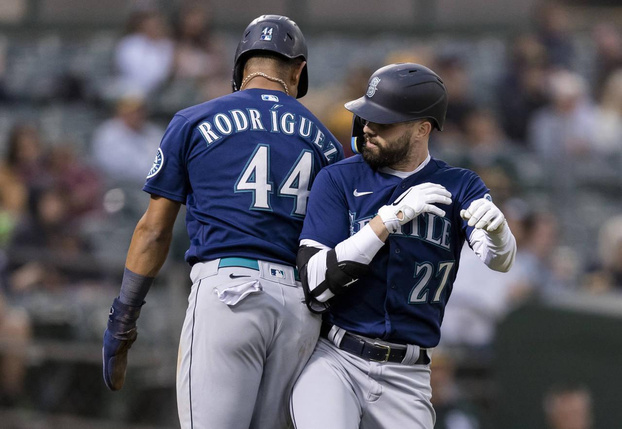 Seattle Mariners' Jesse Winker celebrates with Julio Rodriguez, left, after hitting a two-run home ...