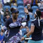 
              Serena Williams of the United States, left, and Ons Jabeur of Tunisia celebrate after wining their doubles tennis match against Marie Bouzkova of Czech Republic and Sara Sorribes Tormo of Spain at the Eastbourne International tennis tournament in Eastbourne, England, Tuesday, June 21, 2022. (AP Photo/Kirsty Wigglesworth)
            