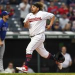 
              Cleveland Guardians' Josh Naylor scores on a double by Andrés Giménez against the Texas Rangers during the second inning of a baseball game Wednesday, June 8, 2022, in Cleveland. (AP Photo/Nick Cammett)
            