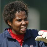 
              FILE - Team USA goalkeeper Briana Scurry reacts during a training session for the Four Nations women's soccer tournament in China's southern city, Guangzhou, Monday, Jan. 29, 2007. She has faced challenges as an openly gay Black woman in what was a predominately white sport. There were hardly any players who looked like her when she stepped on the sport's biggest stage; today the US national soccer team's roster features eight women of color. (AP Photo/Vincent Yu, File)
            