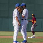 
              Florida pitcher Brandon Sproat, right, meets with infielder Colby Halter (5) during an NCAA college baseball tournament regional game against Central Michigan on Friday, June 3, 2022, in Gainesville, Fla. (Cyndi Chambers/Ocala Star-Banner via AP)
            