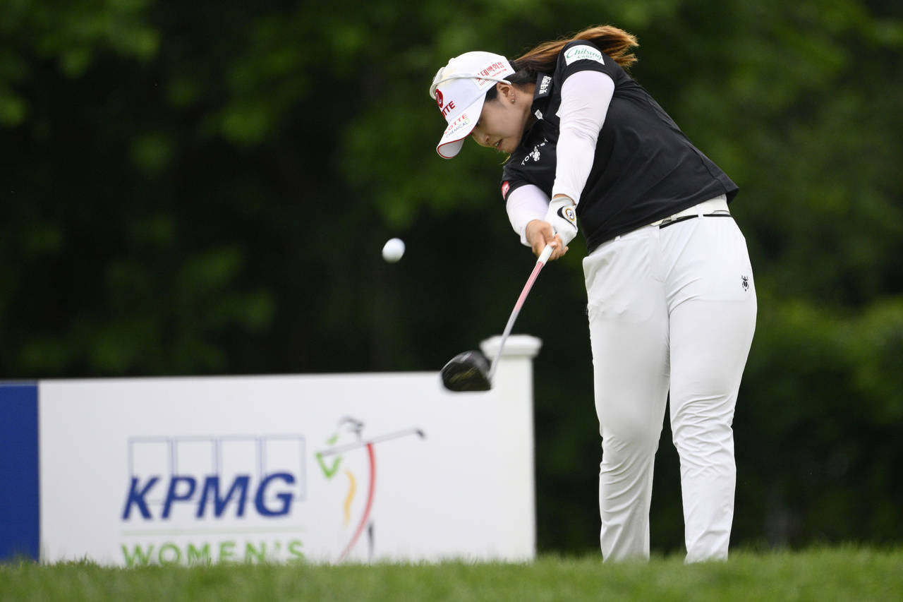 Hye-Jin Choi, of South Korea, tees off on the 18th hole during the first round in the Women's PGA C...