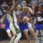 
              Connecticut Sun guard Courtney Williams (10) calls for a timeout while under pressure from Seattle Storm guard Jewell Loyd, left, and forward Breanna Stewart during a WNBA basketball game Friday, June 17, 2022, in Uncasville, Conn. (Sean D. Eliot/The Day via AP)
            
