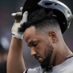 
              Chicago White Sox's Jose Abreu takes off his helmet after he lined out during the fourth inning of a baseball game against the Los Angeles Angels, Monday, June 27, 2022, in Anaheim, Calif. (AP Photo/Jae C. Hong)
            
