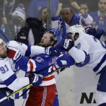 
              Tampa Bay Lightning center Steven Stamkos (91) and New York Rangers left wing Alexis Lafrenière (13) fight at the end of Game 5 of the NHL Hockey Stanley Cup playoffs Eastern Conference Finals, Thursday, June 9, 2022, in New York (AP Photo/Adam Hunger)
            