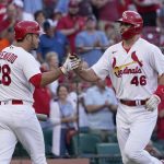
              St. Louis Cardinals' Paul Goldschmidt (46) is congratulated by teammate Nolan Arenado (28) after hitting a solo home run during the first inning of a baseball game against the Miami Marlins Monday, June 27, 2022, in St. Louis. (AP Photo/Jeff Roberson)
            
