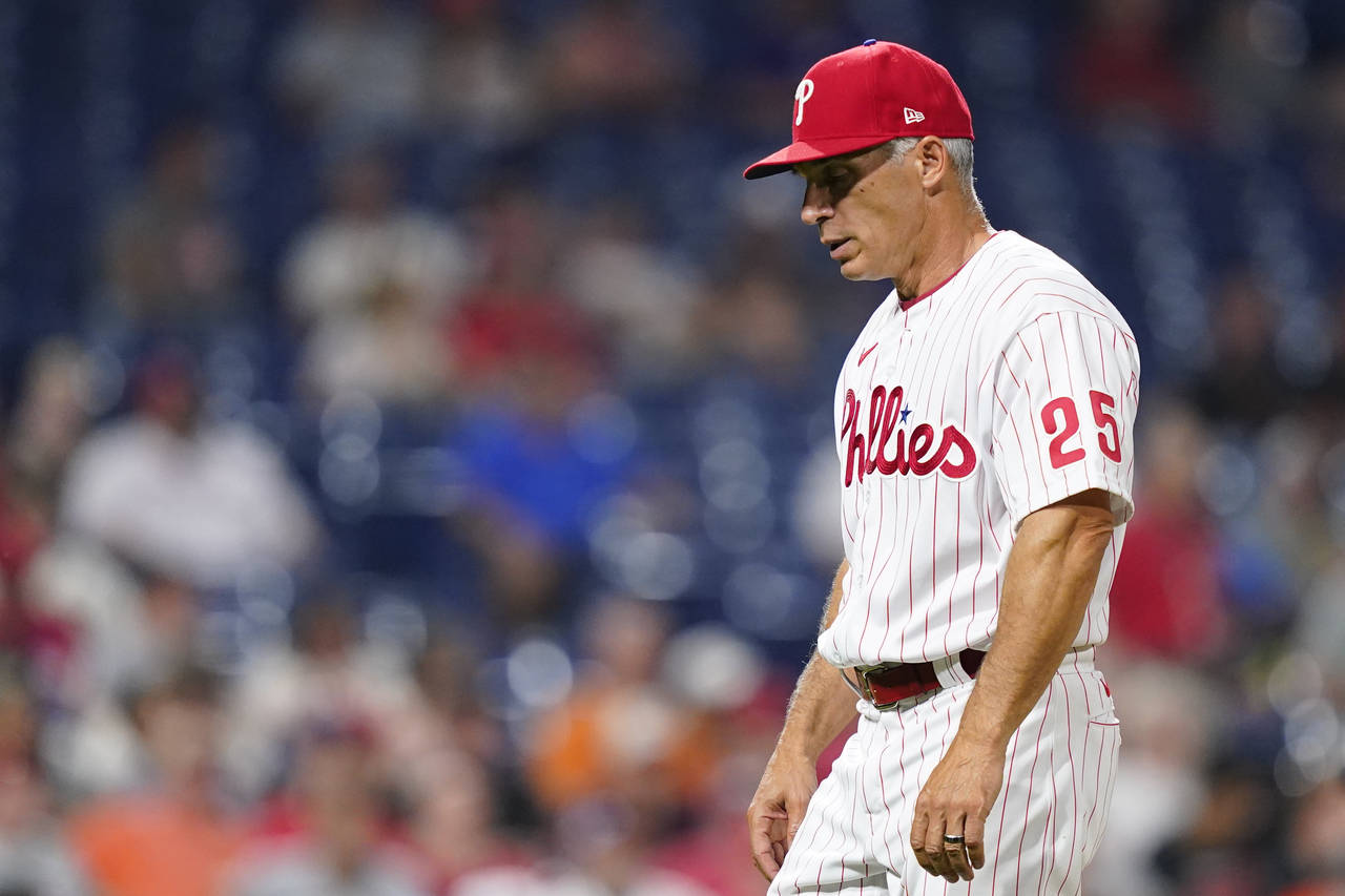 FILE - Philadelphia Phillies' Joe Girardi walks to the dugout during a baseball game, Tuesday, May ...