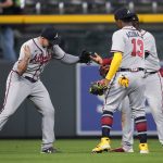 
              Atlanta Braves left fielder Adam Duvall, left, celebrates with right fielder Ronald Acuna Jr., front right, and center fielder Michael Harris II after the team's baseball game against the Colorado Rockies on Saturday, June 4, 2022, in Denver. (AP Photo/David Zalubowski)
            