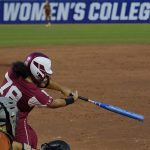 
              Oklahoma's Jocelyn Alo hits a single against Texas during the sixth inning of the second game of the NCAA Women's College World Series softball championship series Thursday, June 9, 2022, in Oklahoma City. (AP Photo/Sue Ogrocki)
            