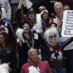 
              Colorado Avalanche fans watch during the second period in Game 2 of the team's NHL hockey Stanley Cup Final against the Tampa Bay Lightning, Saturday, June 18, 2022, in Denver. (AP Photo/David Zalubowski)
            