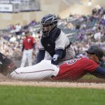 
              Minnesota Twins' Byron Buxton beats the tag by New York Yankees catcher Jose Trevino to score from third base on a sacrifice fly by Max Kepler during the first inning of a baseball game Tuesday, June 7, 2022, in Minneapolis. (AP Photo/Jim Mone)
            