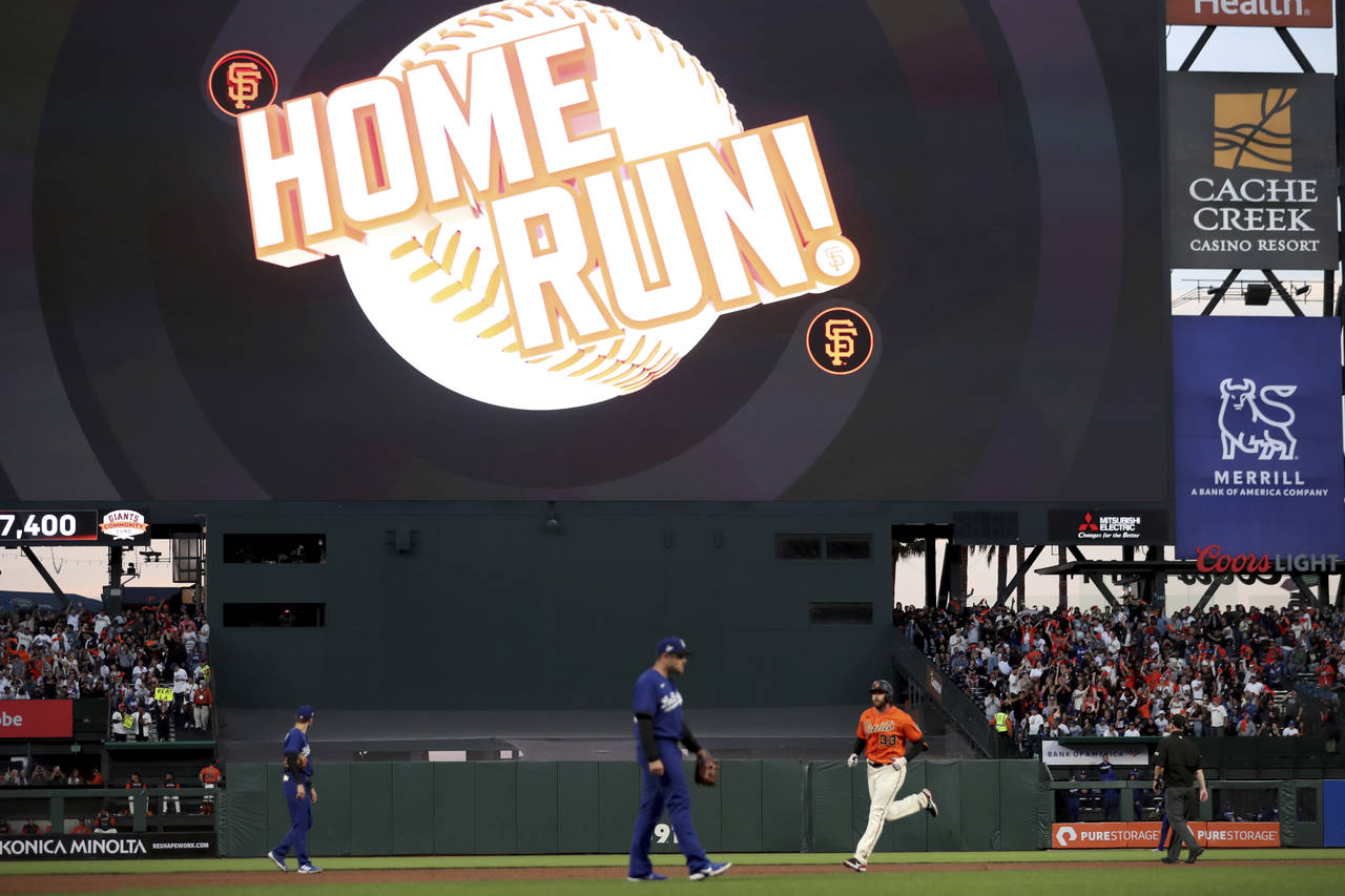 San Francisco Giants' Darin Ruf rounds the bases after hitting a home run against the Los Angeles D...