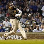 
              San Diego Padres' Manny Machado gets his 1,499th career hit, an RBI single off Chicago Cubs relief pitcher Rowan Wick, scoring Jurickson Profar during the eighth inning of a baseball game Monday, June 13, 2022, in Chicago. (AP Photo/Charles Rex Arbogast)
            